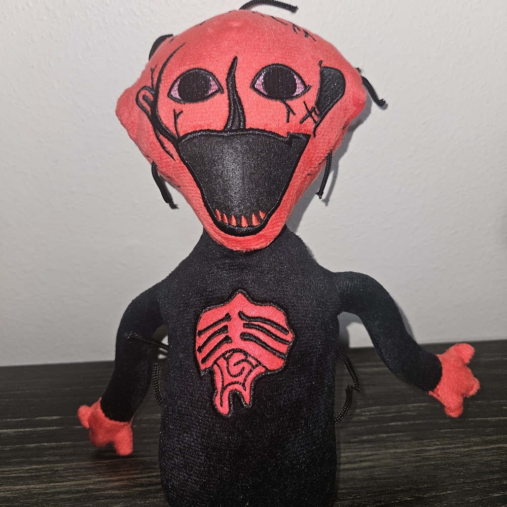 Red and Black Plush Toy